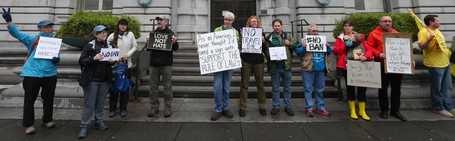 Protestors against President Donald Trump's temporary immigration ban on seven Muslim-majority nations. (Photo by Elijah Nouvelage/Getty Images)
