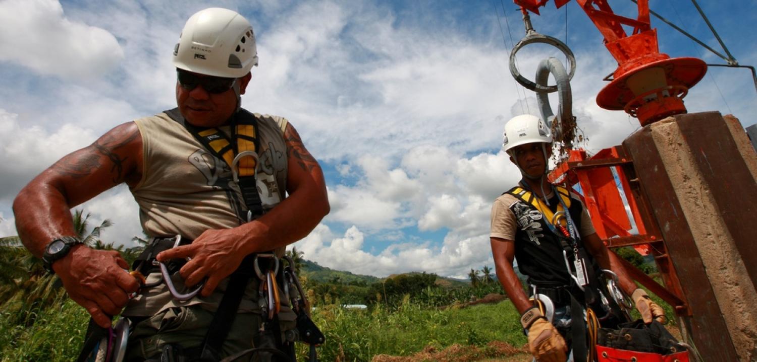 UN staff repair a radio tower in Timor-Leste. (Flickr/UN Photo)