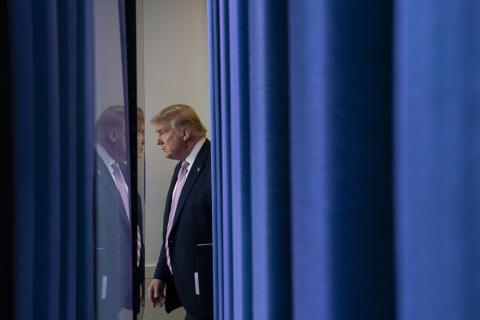 US President Donald Trump arriving in the White House press briefing room, 4 April (Sarah Silbiger/Getty Images)
